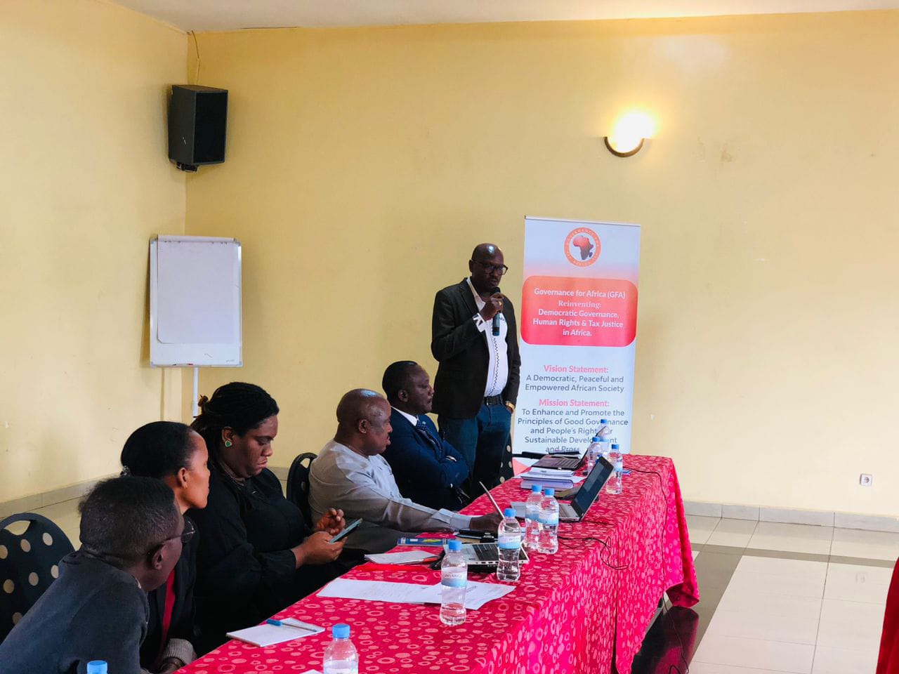 A GFA speaker addressing a panel session beneath the organisation banner.